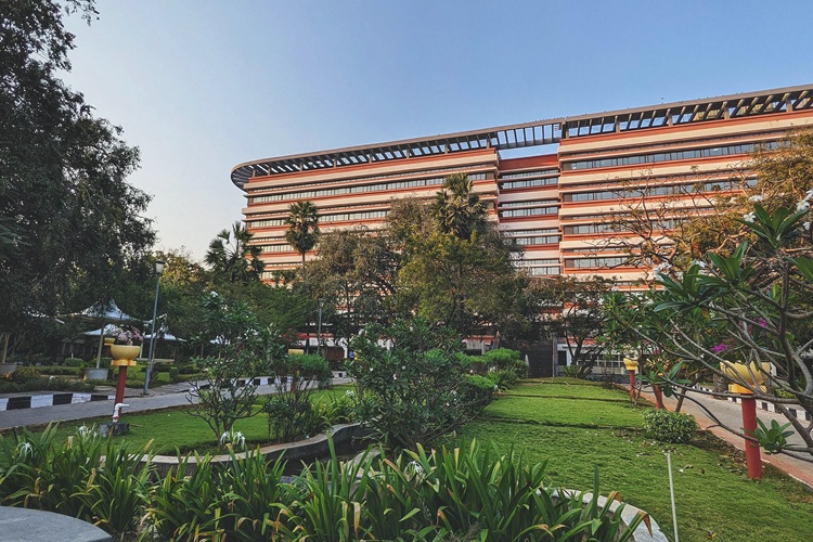 Large building with grassy area in the foreground